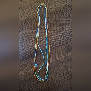 Noisy Plume seed bead strand necklaces.